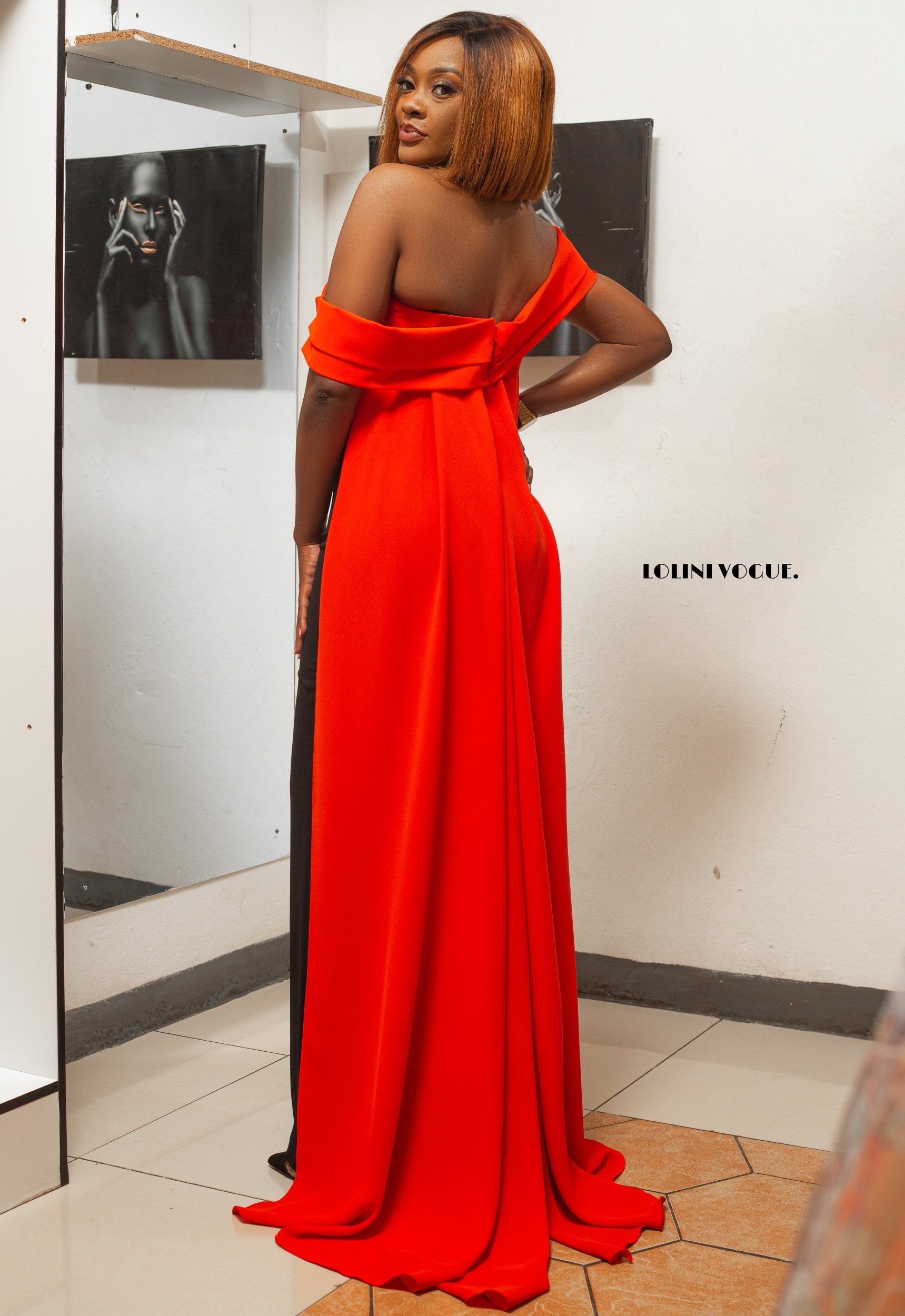 Palazzo fit jumpsuit in black with an orange back drape