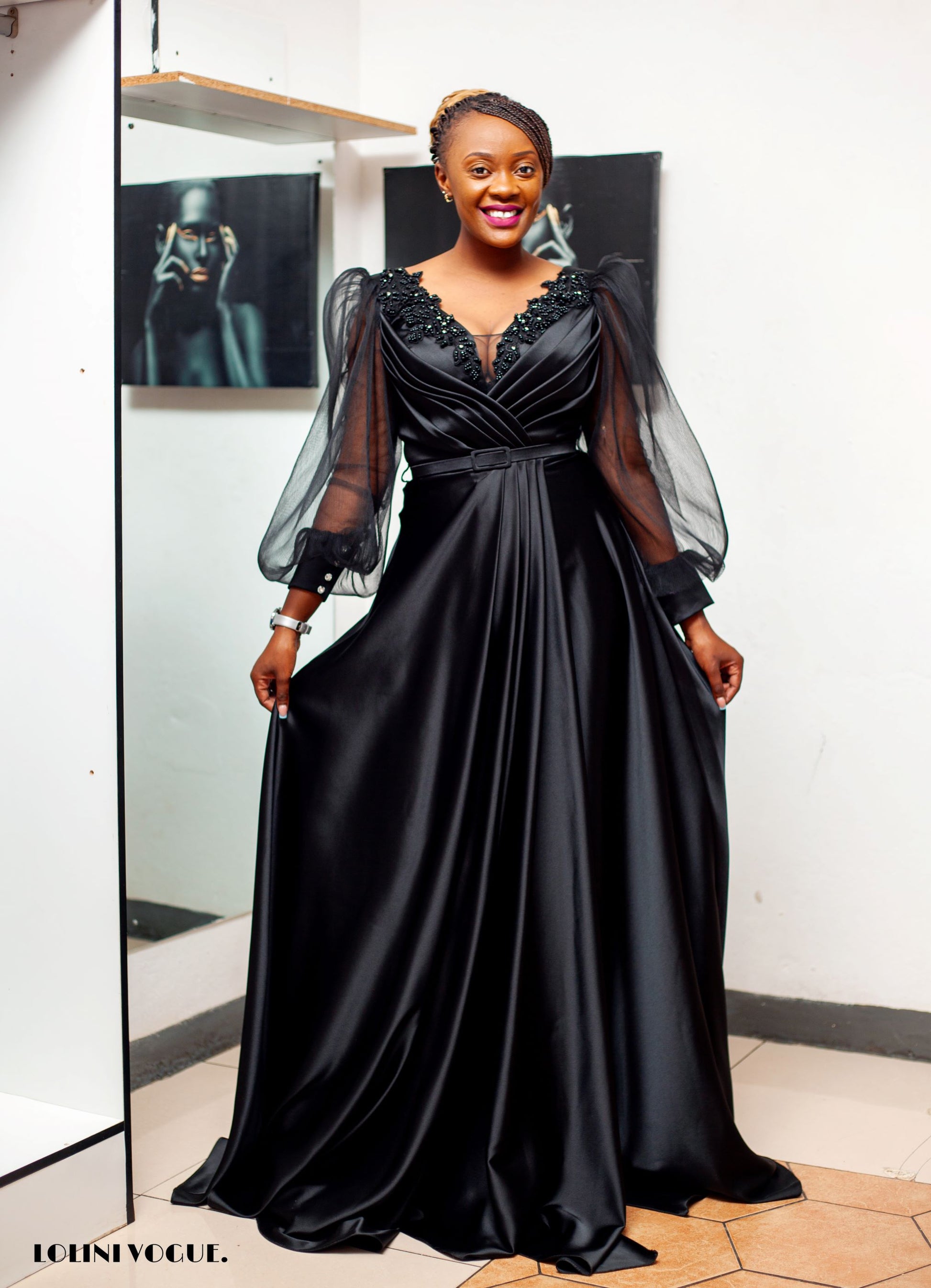 black elegant evening gown with front slit and puffy sleeves