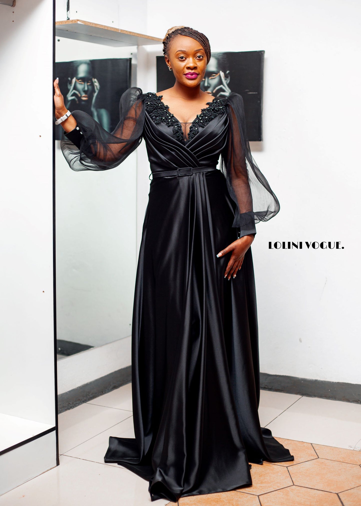 black elegant evening gown with front slit and puffy sleeves