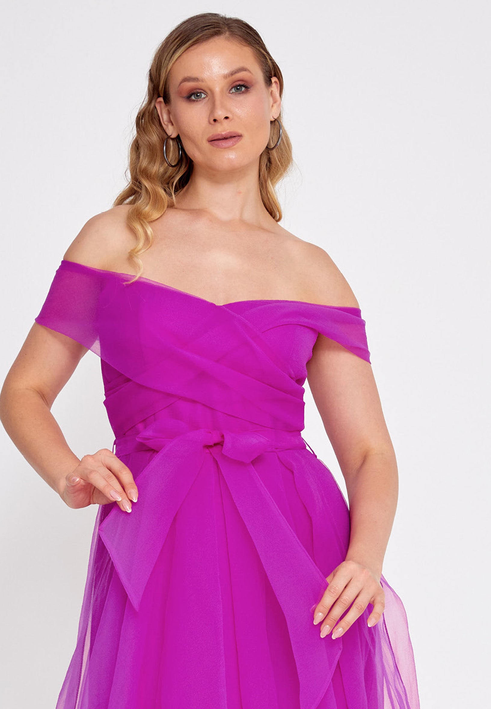 fuchsia flared dress with a wrap off shoulder neckline