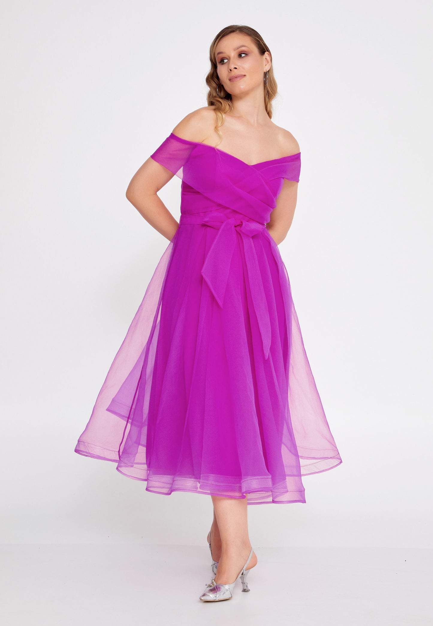 fuchsia flared dress with a wrap off shoulder neckline