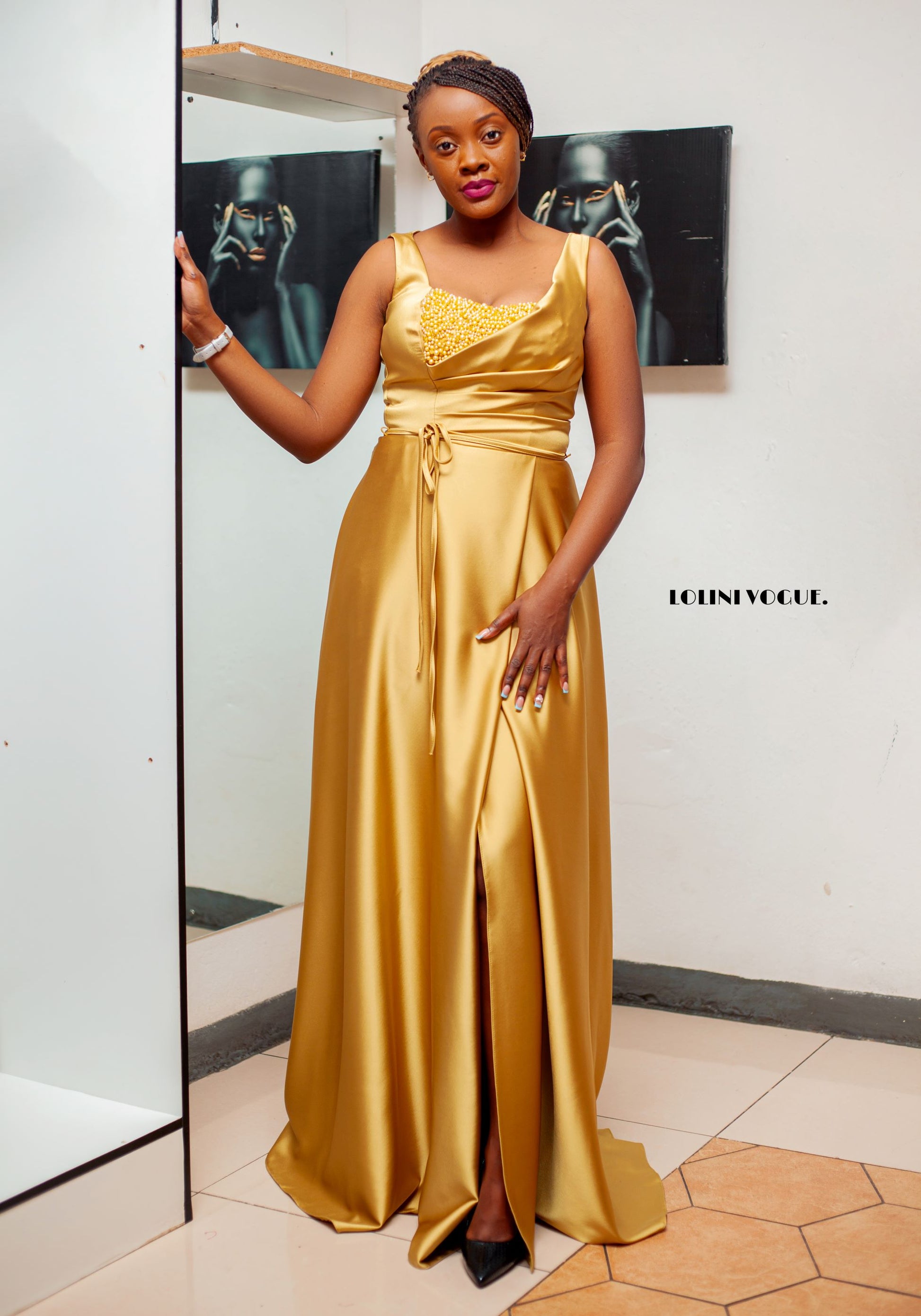 gold sleeveless evening gown with front pearl details