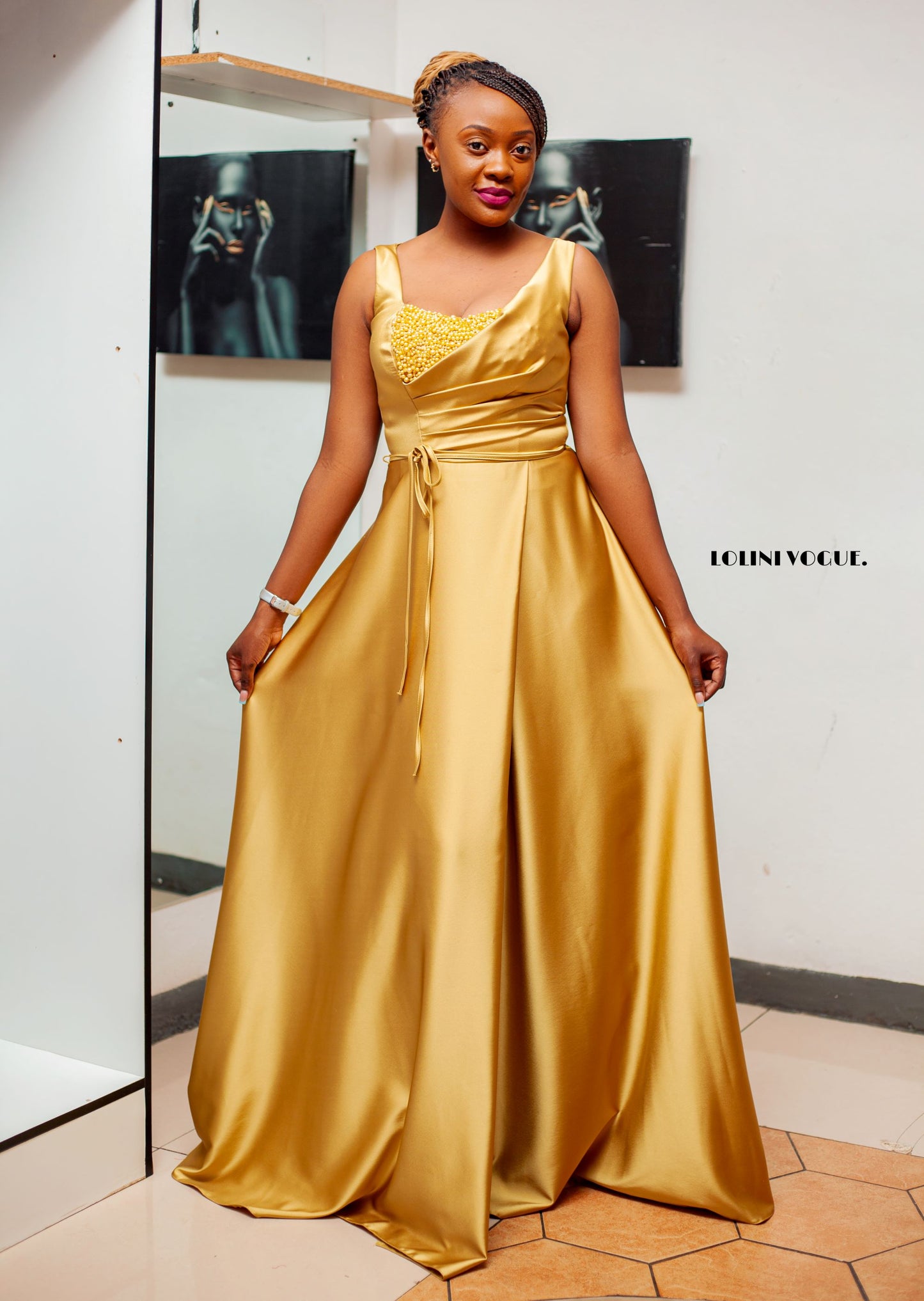 gold sleeveless evening gown with front pearl details