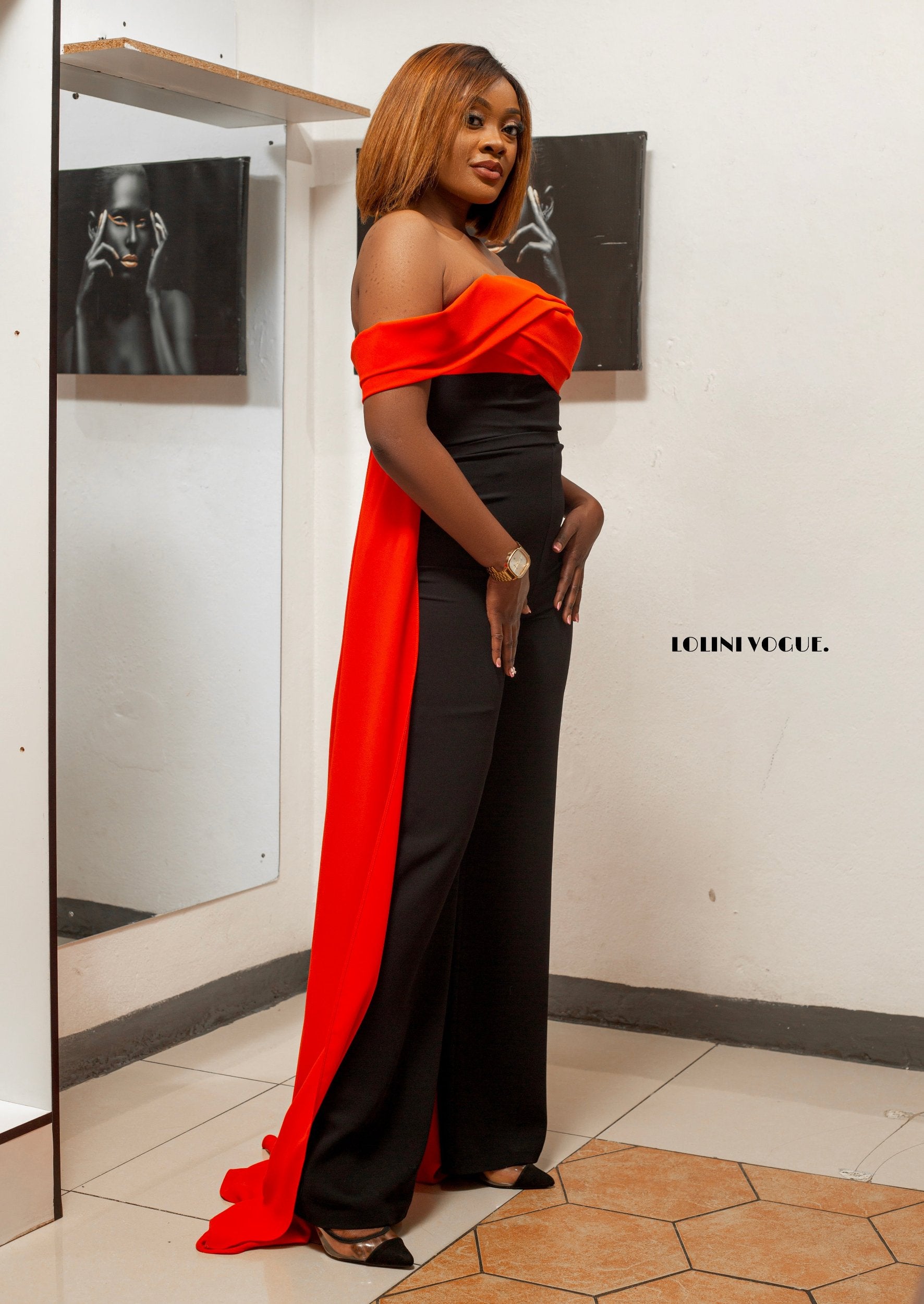 Palazzo fit jumpsuit in black with an orange back drape