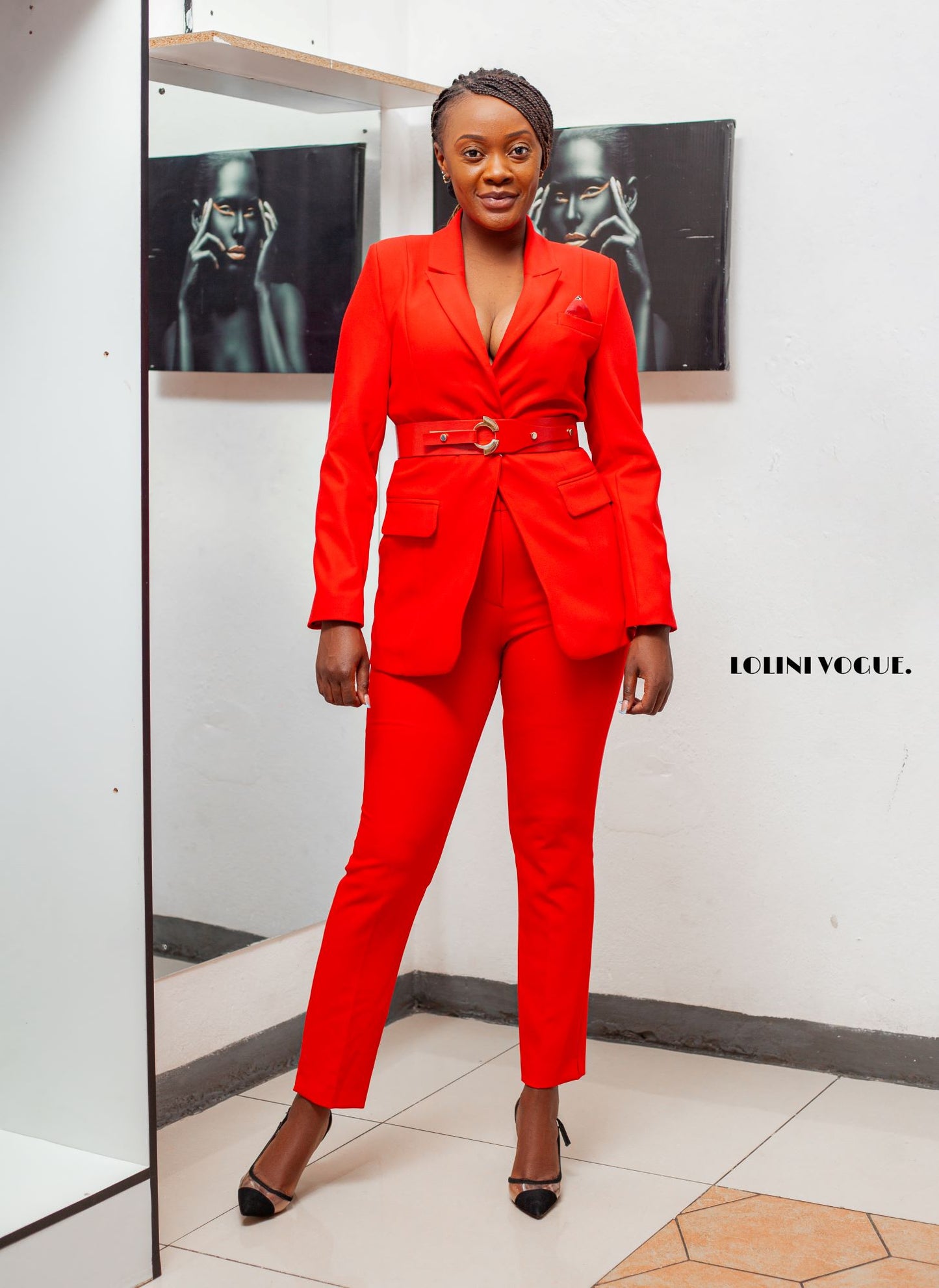 red ankle length pant suit with tailor fitted jacket that comes with a belt